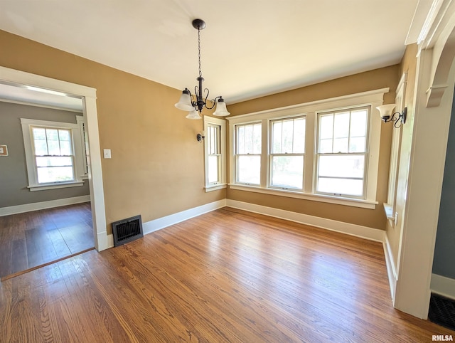 1101 S 4th St, Pekin, IL 61554 - unfurnished dining area with a chandelier and dark wood-style floors