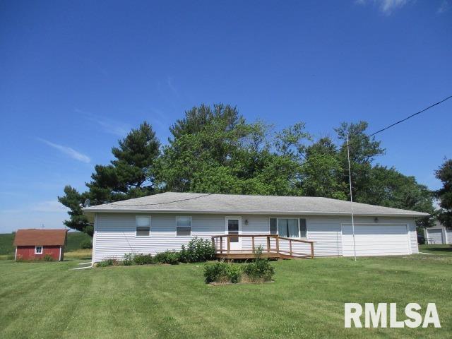 1265 Spring Bay Rd, East Peoria, IL 61611 - view of front of property featuring a front yard, a deck, a garage, and a shed