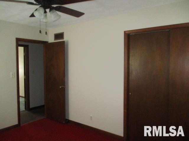 1265 Spring Bay Rd, East Peoria, IL 61611 - unfurnished bedroom with carpet and a ceiling fan
