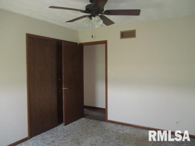 1265 Spring Bay Rd, East Peoria, IL 61611 - unfurnished bedroom featuring carpet floors, a closet, and ceiling fan
