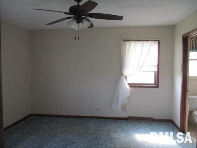 1265 Spring Bay Rd, East Peoria, IL 61611 - carpeted spare room featuring a ceiling fan and baseboards