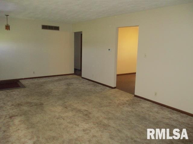 1265 Spring Bay Rd, East Peoria, IL 61611 - spare room with carpet flooring and baseboards