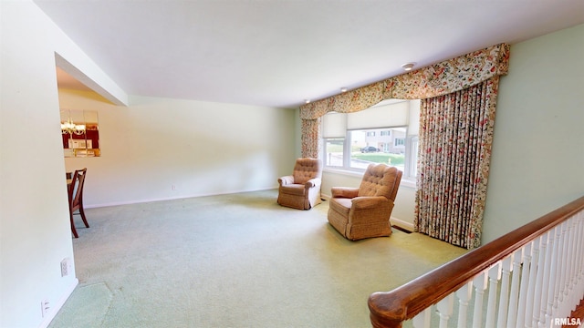 1729 W Willow Wood Dr, Peoria, IL 61614 - sitting room featuring a chandelier and carpet flooring