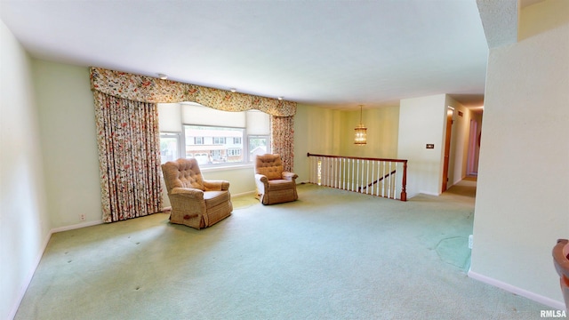 1729 W Willow Wood Dr, Peoria, IL 61614 - living area with carpet and an upstairs landing