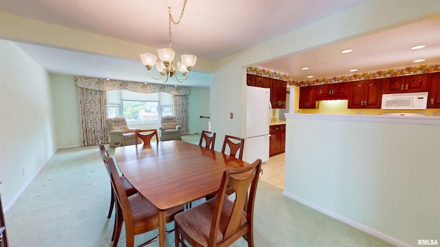 1729 W Willow Wood Dr, Peoria, IL 61614 - dining area featuring a chandelier, light carpet, and recessed lighting