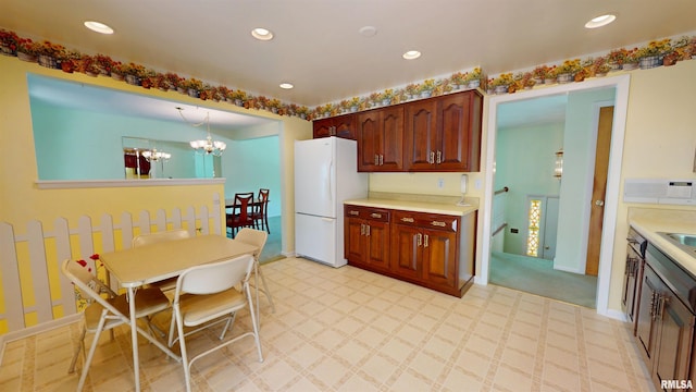 1729 W Willow Wood Dr, Peoria, IL 61614 - kitchen featuring freestanding refrigerator, a chandelier, light countertops, and recessed lighting