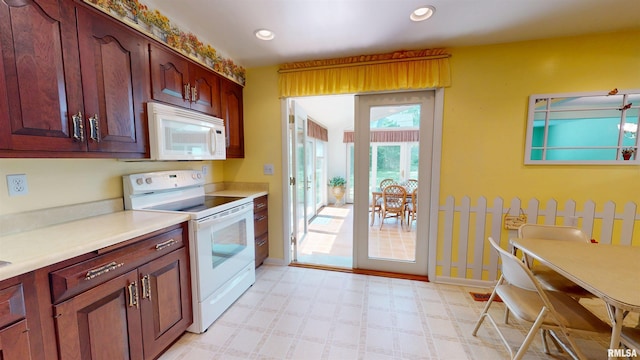 1729 W Willow Wood Dr, Peoria, IL 61614 - kitchen with white appliances, light flooring, light countertops, and recessed lighting