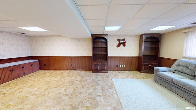 1729 W Willow Wood Dr, Peoria, IL 61614 - living room featuring a wainscoted wall, a drop ceiling, and wooden walls