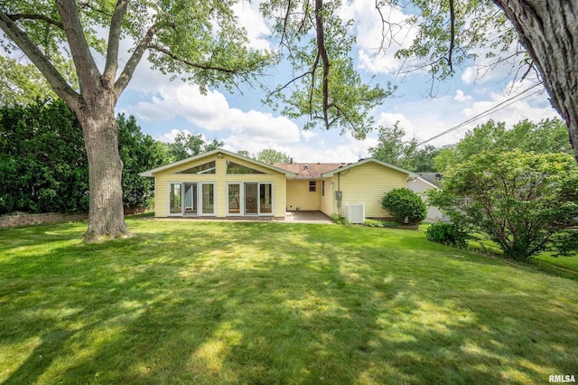 1729 W Willow Wood Dr, Peoria, IL 61614 - rear view of house with a lawn and a patio area
