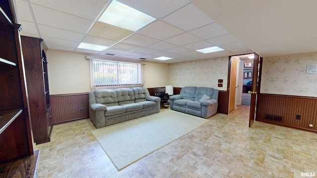 1729 W Willow Wood Dr, Peoria, IL 61614 - living area featuring a wainscoted wall, a drop ceiling, and wood walls