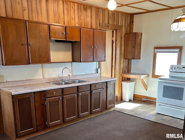1305 S 8th St, Pekin, IL 61554 - kitchen featuring white electric range, light countertops, decorative light fixtures, and dark carpet