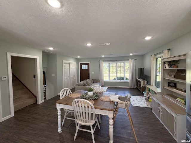 276 E Far Hills Dr, East Peoria, IL 61611 - dining space featuring dark wood-style floors, stairs, recessed lighting, and a textured ceiling