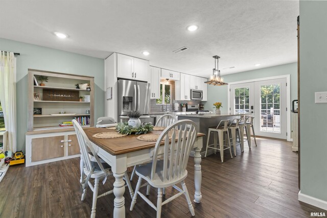 276 E Far Hills Dr, East Peoria, IL 61611 - dining space with plenty of natural light, dark wood finished floors, and recessed lighting