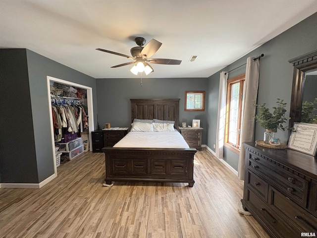 276 E Far Hills Dr, East Peoria, IL 61611 - bedroom featuring light wood finished floors, a closet, and ceiling fan