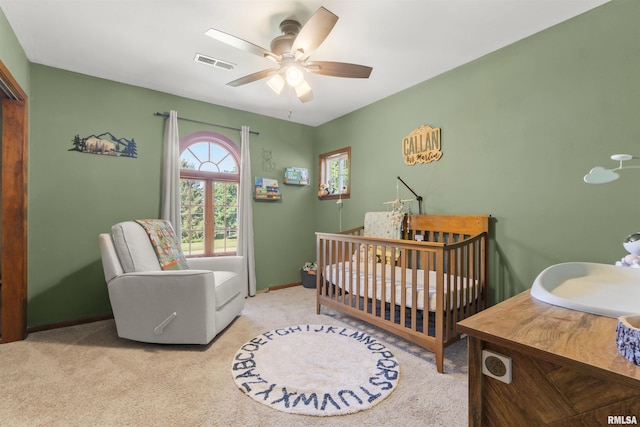 276 E Far Hills Dr, East Peoria, IL 61611 - carpeted bedroom featuring a crib and a ceiling fan