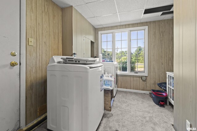 276 E Far Hills Dr, East Peoria, IL 61611 - laundry area featuring washer and clothes dryer, carpet flooring, and wood walls