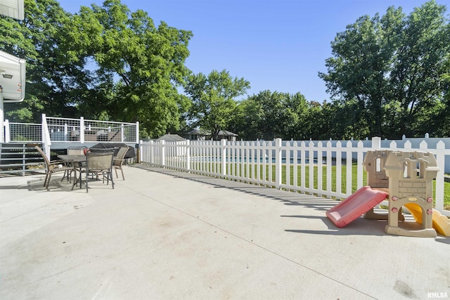 276 E Far Hills Dr, East Peoria, IL 61611 - view of patio with outdoor dining space and a playground