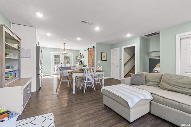 276 E Far Hills Dr, East Peoria, IL 61611 - living room with a barn door, stairway, recessed lighting, dark wood-type flooring, and french doors