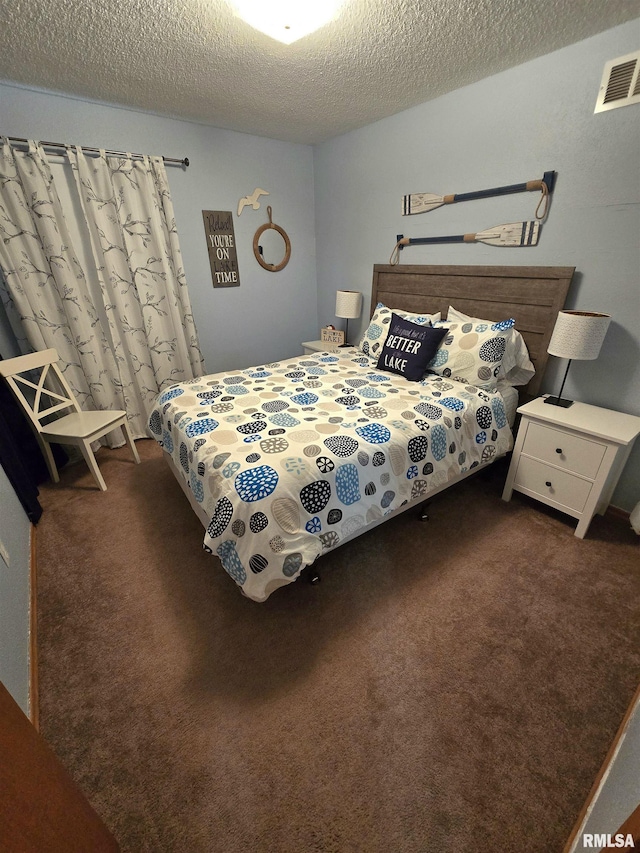 1515 Lakeview Rd N, Dahinda, IL 61428 - bedroom featuring dark colored carpet and a textured ceiling