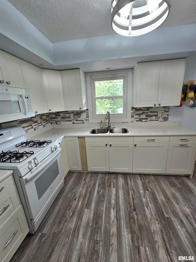 1515 Lakeview Rd N, Dahinda, IL 61428 - kitchen featuring white appliances, a textured ceiling, white cabinets, tasteful backsplash, and dark wood-style flooring