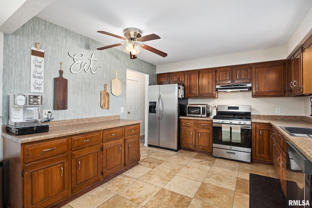 114 Julian Ave, East Peoria, IL 61611 - kitchen with stainless steel appliances, under cabinet range hood, ceiling fan, wallpapered walls, and light countertops