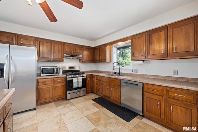 114 Julian Ave, East Peoria, IL 61611 - kitchen with appliances with stainless steel finishes, under cabinet range hood, and brown cabinets