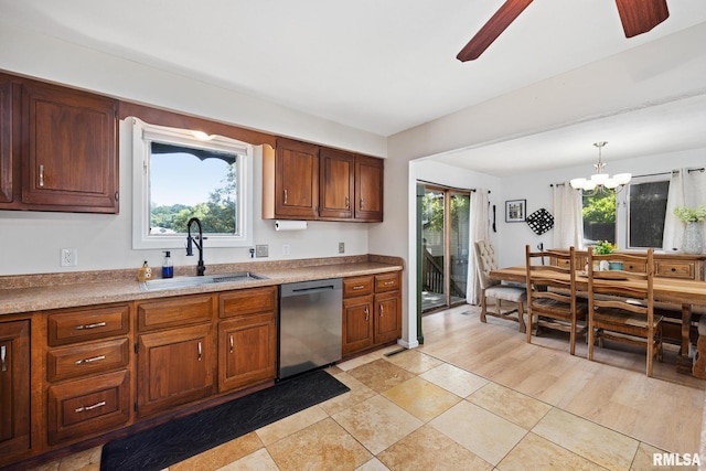 114 Julian Ave, East Peoria, IL 61611 - kitchen featuring dishwasher, a chandelier, ceiling fan, pendant lighting, and brown cabinets