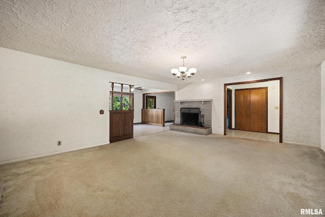 22475 N Main St, Morton, IL 61550 - unfurnished living room with a chandelier, a textured ceiling, light colored carpet, a brick fireplace, and a textured wall