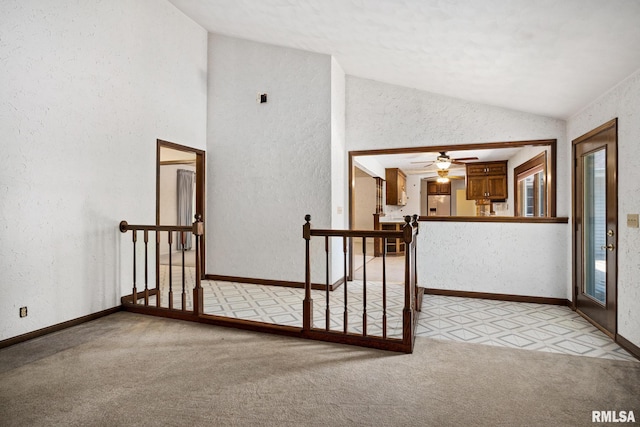 22475 N Main St, Morton, IL 61550 - stairway featuring vaulted ceiling, carpet, a textured wall, and ceiling fan