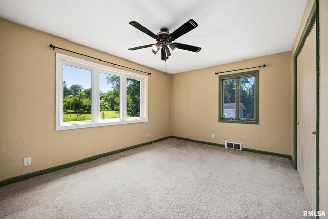 22475 N Main St, Morton, IL 61550 - empty room with a ceiling fan, carpet floors, and a textured wall