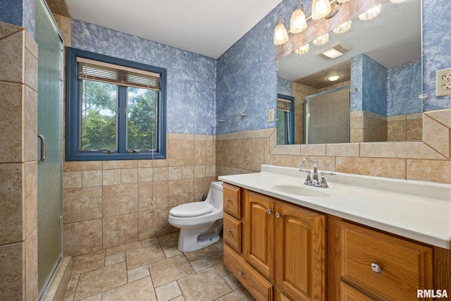 22475 N Main St, Morton, IL 61550 - full bathroom with tile walls, vanity, a stall shower, stone finish floors, and a wainscoted wall