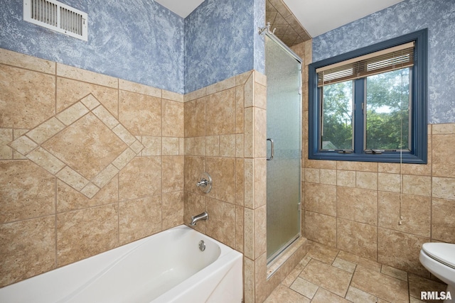 22475 N Main St, Morton, IL 61550 - bathroom featuring a shower with shower door, a tub to relax in, tile walls, and stone finish flooring