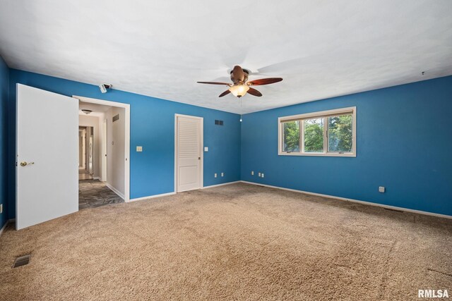 22475 N Main St, Morton, IL 61550 - unfurnished bedroom featuring carpet floors and a ceiling fan