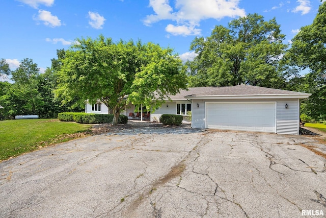 22475 N Main St, Morton, IL 61550 - view of front of home with driveway, a front yard, and a garage