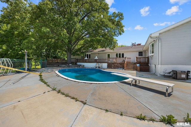 22475 N Main St, Morton, IL 61550 - view of swimming pool featuring a deck, a patio area, and a diving board
