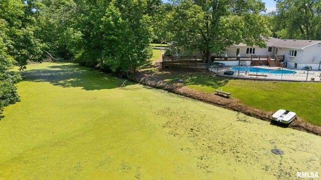 22475 N Main St, Morton, IL 61550 - view of yard featuring a deck and view of wooded area
