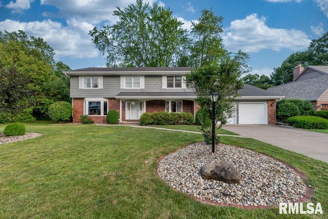 210 W Wolf Rd, Peoria, IL 61614 - traditional home with brick siding, concrete driveway, a garage, and a front yard