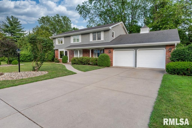 210 W Wolf Rd, Peoria, IL 61614 - traditional-style home featuring an attached garage, brick siding, a front lawn, and concrete driveway