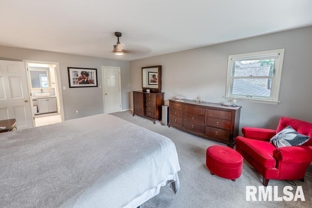 210 W Wolf Rd, Peoria, IL 61614 - bedroom featuring light carpet, multiple windows, ensuite bath, and ceiling fan