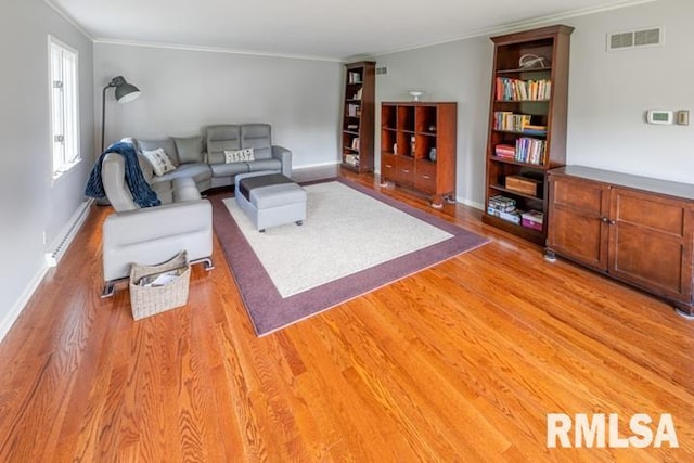 210 W Wolf Rd, Peoria, IL 61614 - living room featuring light wood-type flooring and ornamental molding