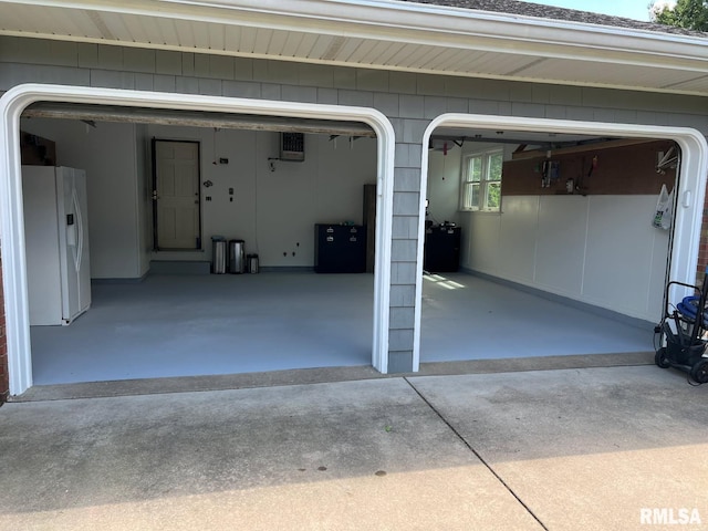 210 W Wolf Rd, Peoria, IL 61614 - garage with white refrigerator with ice dispenser