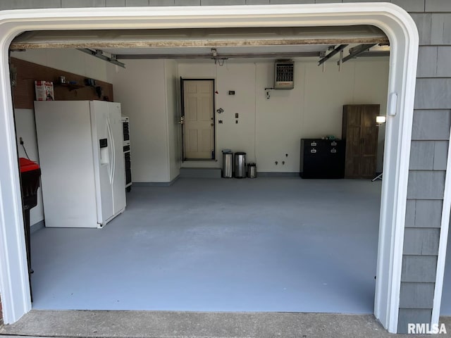 210 W Wolf Rd, Peoria, IL 61614 - garage with white fridge with ice dispenser