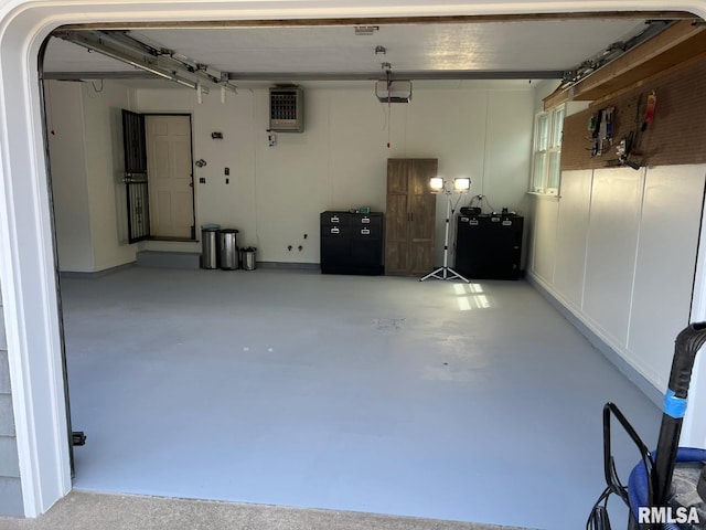 210 W Wolf Rd, Peoria, IL 61614 - garage featuring a garage door opener