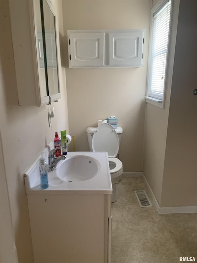 519 E Davis St, Bushnell, IL 61422 - half bathroom featuring toilet and vanity