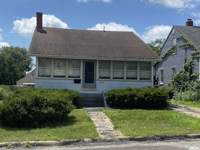 1228 E Lake Ave, Peoria Heights, IL 61616 - bungalow with a chimney, roof with shingles, and entry steps