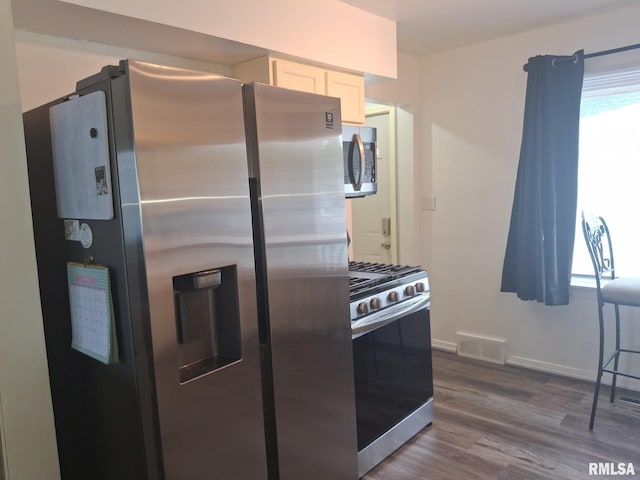 1519 S 3rd St, Pekin, IL 61554 - kitchen featuring appliances with stainless steel finishes, white cabinetry, and dark wood-style flooring