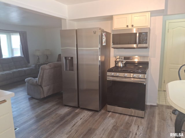 1519 S 3rd St, Pekin, IL 61554 - kitchen with stainless steel appliances, dark wood-style floors, and open floor plan