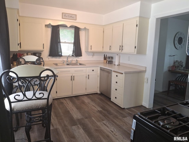 1519 S 3rd St, Pekin, IL 61554 - kitchen with stainless steel dishwasher, black gas stove, light countertops, white cabinetry, and dark wood-style floors