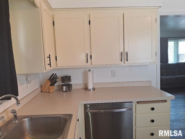 1519 S 3rd St, Pekin, IL 61554 - kitchen featuring dishwasher, light countertops, white cabinetry, and wood finished floors