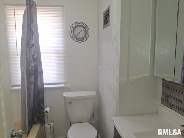 1519 S 3rd St, Pekin, IL 61554 - full bath with vanity, shower / bath combo, and tile walls